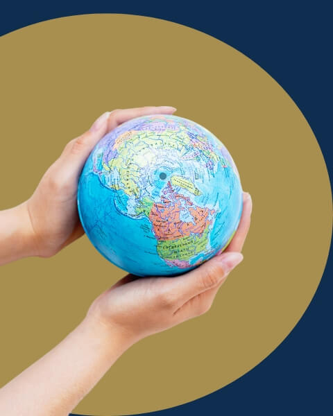 hands holding globe