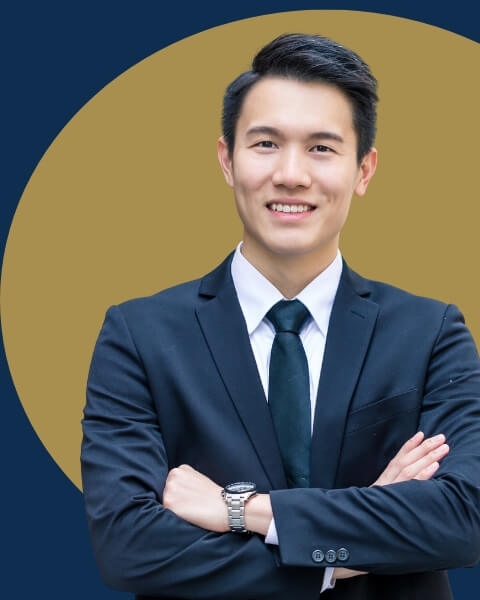 person wearing suit, crossing arms